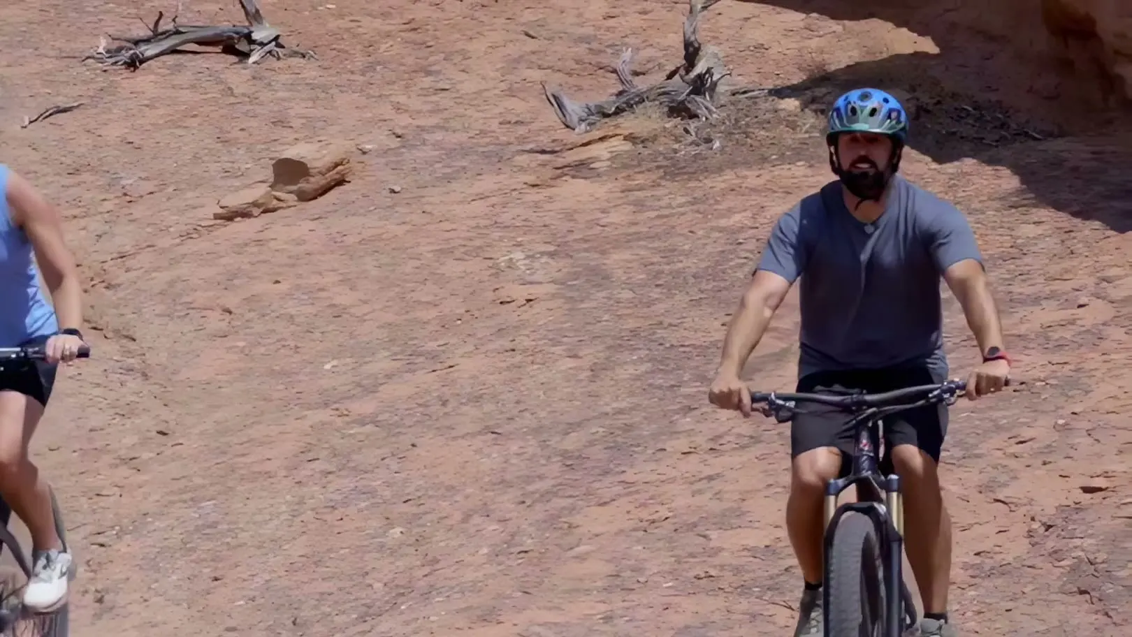 Dr. Russell Smith mountain biking on red rock