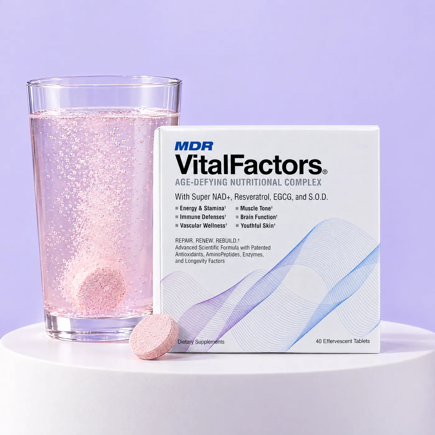 VitalFactors box, two tablets and a glass of pink sparkling water