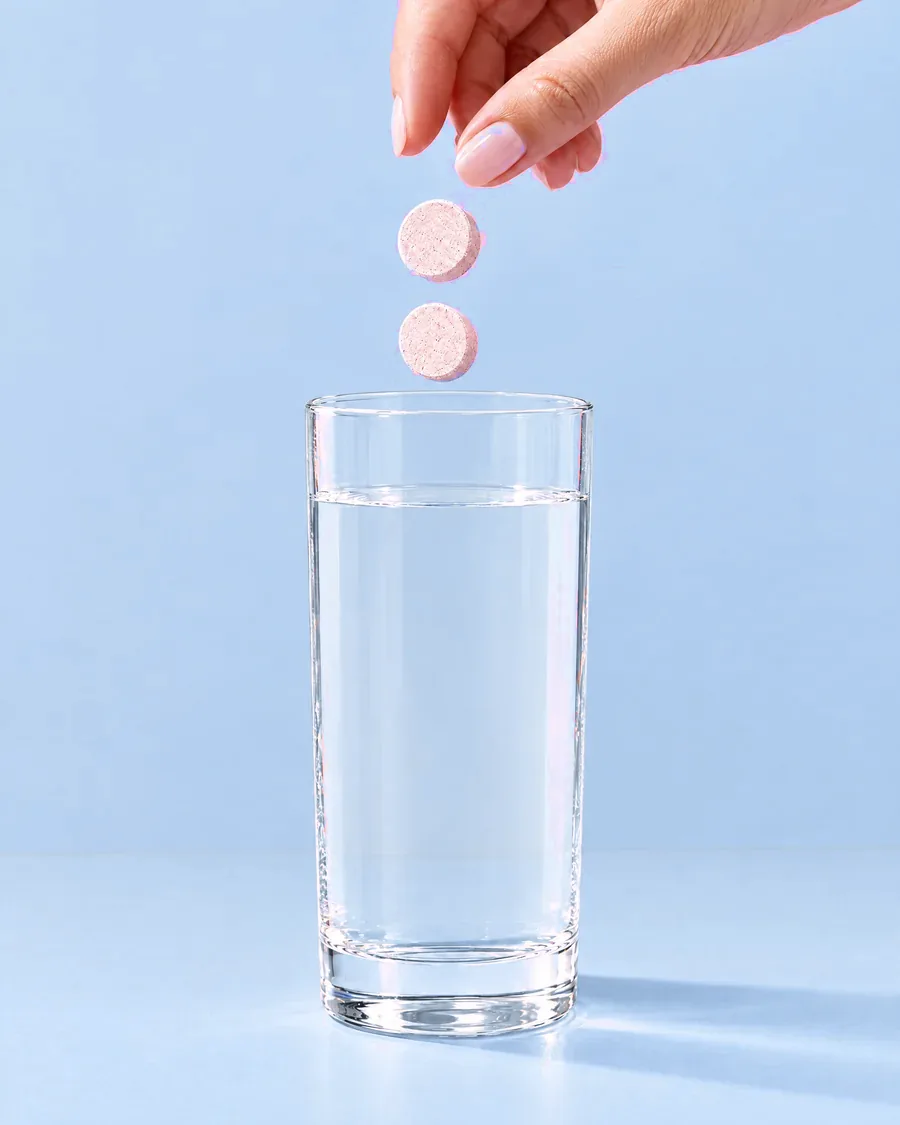Two tablets into a glass of water.